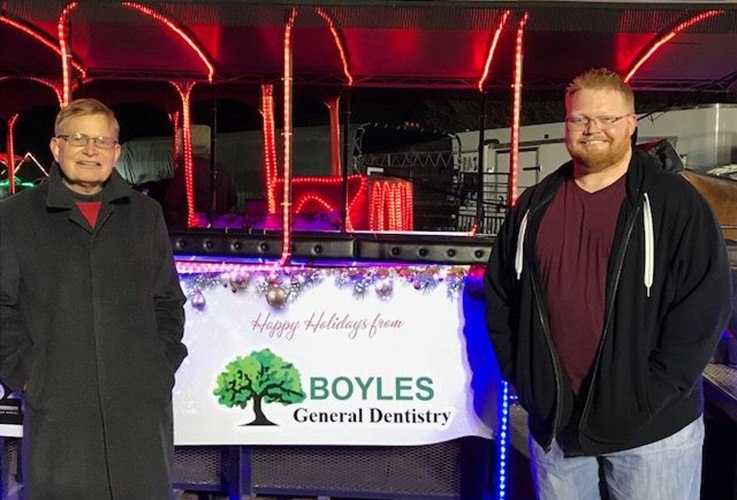 Dr. Franklin and Stephen Boyles by holiday trolley