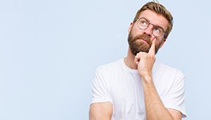 man thinking about why dental implants fail